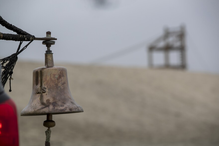 A bell hangs on the beach during Navy SEAL Hell Week at Naval Base Coronado. Sailors can voluntarily quit SEAL training by ringing the bell three times. 