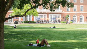 A person reads on the Main Quad at the University of Illinois Urbana-Champaign.