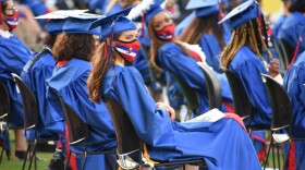 A high school graduation ceremony in South Bend, held outside due to COVID-19 safety precautions.