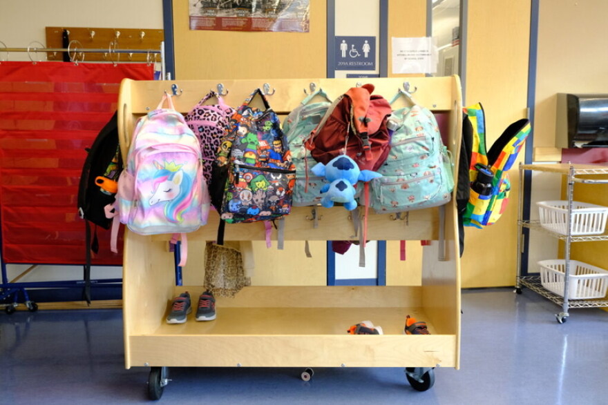 Student backpacks hang in their cubbies at a school in Alaska. At least 30 states have opted into a federal program allowing individuals to receive tax credits for donations to scholarship organizations that might offer tuition help for private schools or extra tutoring.