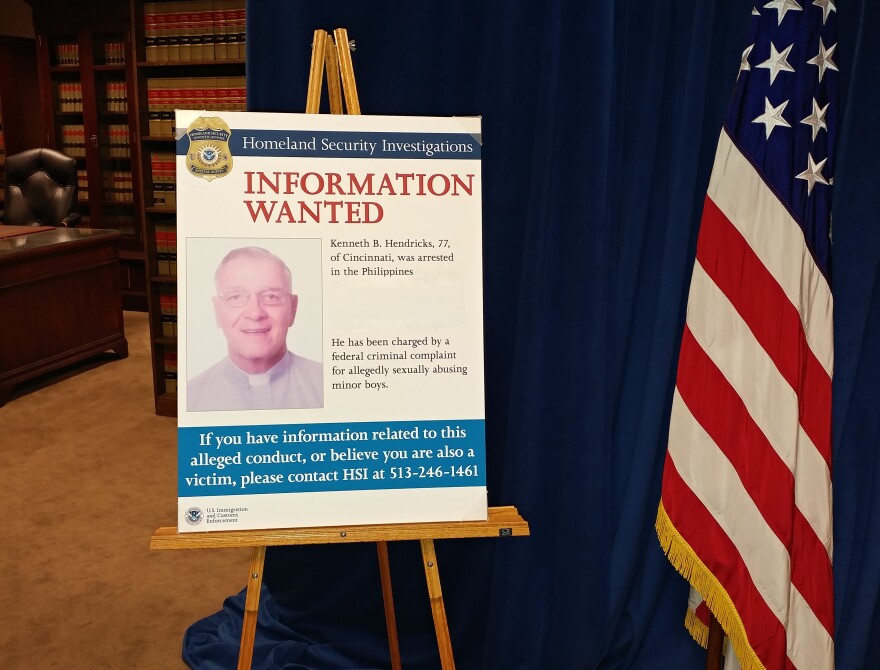A wanted poster for the Rev. Kenneth Bernard Hendricks sits on display at the U.S. Attorney's office.