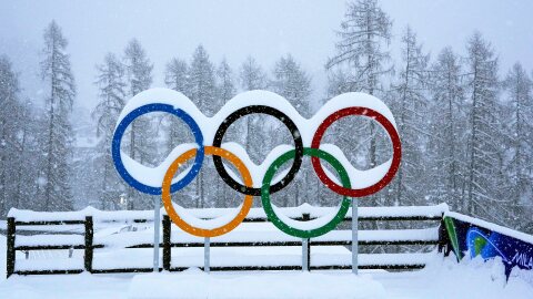 Olympic rings are covered by snow at the sliding center during the 2026 Winter Olympics, in Cortina d'Ampezzo, Italy, Thursday, Feb. 19, 2026. (AP Photo/Alessandra Tarantino)