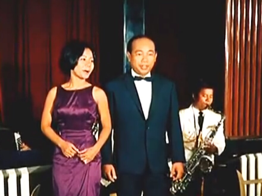 Cambodian psychedelic rock star Sinn Sisamouth (right) performs in the 1966 movie <em>Apsara</em>.