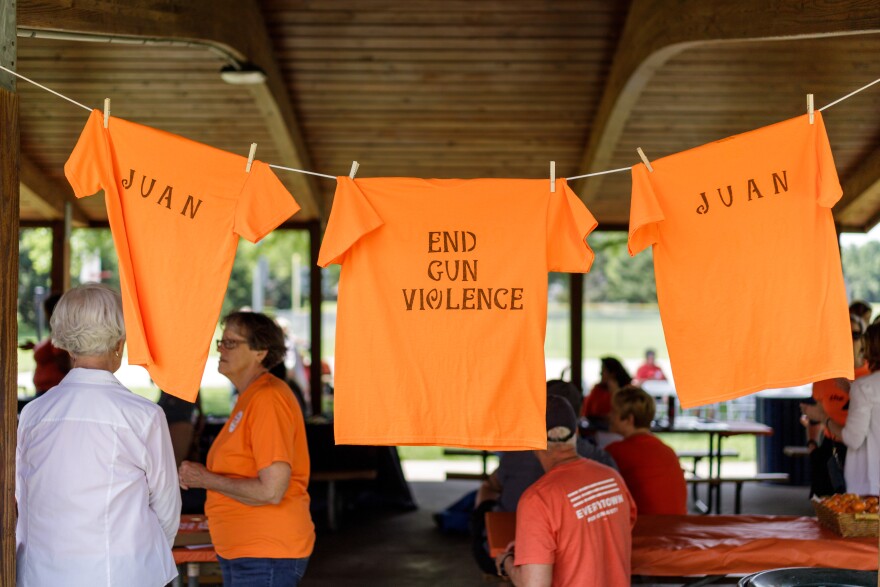 T-shirts hang up at a recent #WearOrange event hosted by Moms Demand Action for Gun Sense in America's local chapter in Normal.