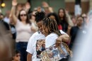 Corey Ruiz’s daughter, right, is embraced as she attends a vigil in memory of her father Thursday, July 23, 2026, in Madison, Wis. Ruiz was shot and killed by Madison police Wednesday afternoon.