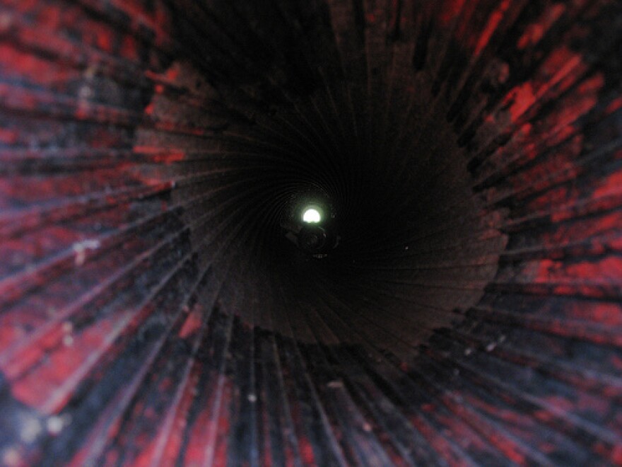 the grooved interior of the barrel of a giant gun.