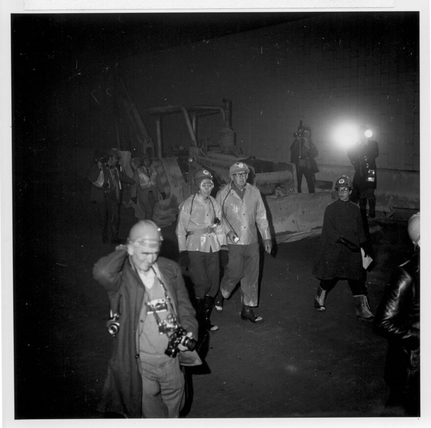 Janet Bonnema walks through the Eisenhower Tunnel in safety gear while it is under construction.