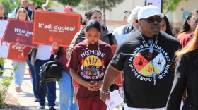 Tize W. Clark, right and his son, Zion Clark, participate in a walk to honor Native American and Indigenous relatives who have gone missing or have been killed as Missing and Murdered Indigenous Persons Awareness Day is marked in Albuquerque, New Mexico, on May 5, 2025.