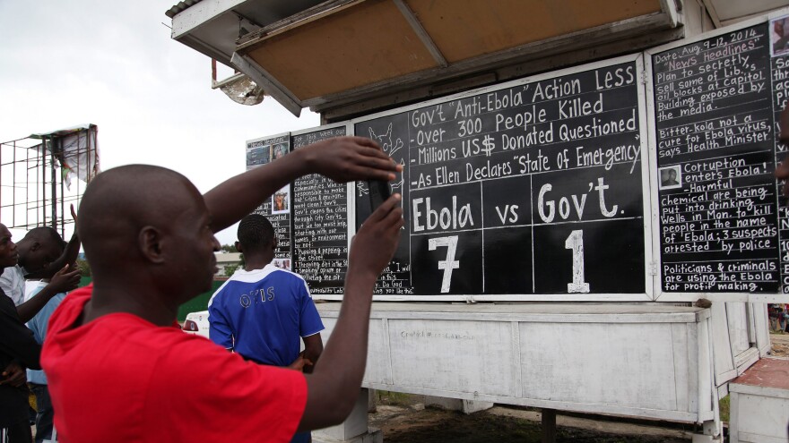 Radio, TV and newspapers aren't the only media used in Liberia to keep the public informed about Ebola. In the capital city of Monrovia, a chalkboard features the latest news about the virus.