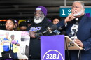 Rev. Dr. Rodney Sadler, representative-elect for NC House District 106, stands with airport union workers during a vigil for ABM employee Colleen Coates.
