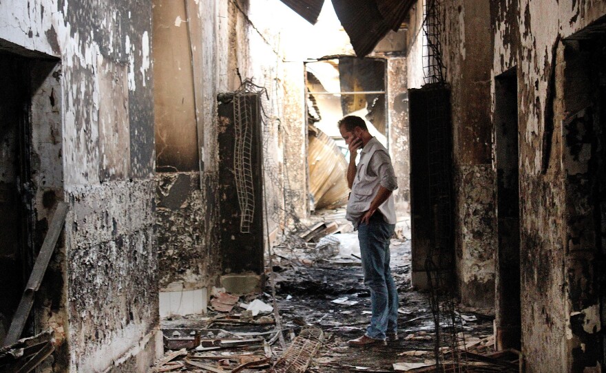 An employee of Doctors Without Borders walks inside the charred remains of the organization's hospital after it was hit by a U.S. airstrike in Kunduz, Afghanistan in October.