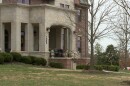 A brick and limestone fraternity house belonging to Phi Kappa Psi