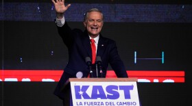 Presidential candidate Jose Antonio Kast of the Republican Party, waves to supporters after early results in the general elections in Santiago, Chile, Sunday, Nov. 16, 2025. (AP Photo/Esteban Felix)