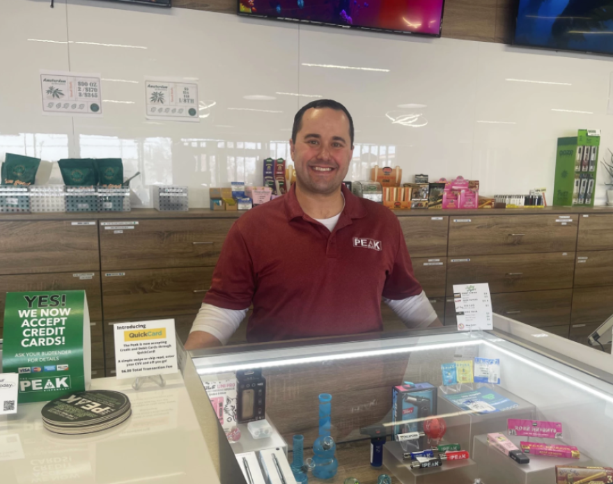 Blake Cantrell, CEO of The Peak, behind the counter at the 36th and May Avenue location in Oklahoma City.