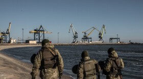 Ukraine's Border Security Force soldiers patrol the coast of the Azov Sea near Mariupol Port on Thursday.