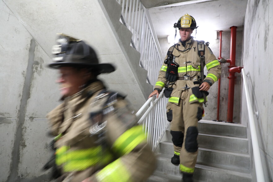 Firefighters take part in the annual Navarre Beach Stair Climb on Friday morning.