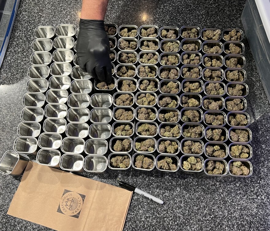  Cannabis being packaged for sale in tins at Greenhouse Farmacy in Missoula, MT.