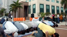 Muslims pray in front of the federal courthouse as they protest the detention of immigrants of all nationalities being held by the federal government in the wake of the Sept. 11 attacks Tuesday, Dec. 25, 2001, in Miami.