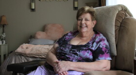 Lynn Schutzman in her studio apartment after she spent two years living in her car. (Yasmin Amer/WBUR)