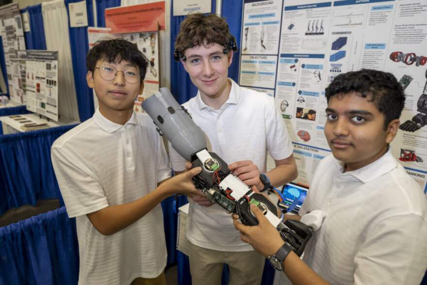 Chanyoung Kim, Samuel Skotnikov, and Eeshaan Prashanth, winners of the 2025 Gordon E. Moore Award at the Regeneron International Science and Engineering Fair. (Courtesy of Chris Ayers Photography and the Society for Science)