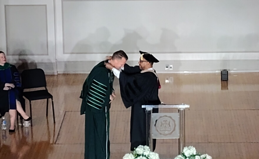 EMU Board of Regents Chair Nathan Ford presents the Presidential Medallion to Dr. Brendan Kelly at his investiture on September 18, 2026.