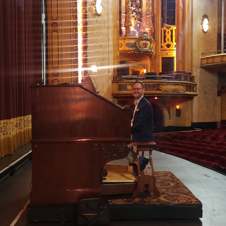 Richard Hills sits at Shea's Buffalo Theatre's Mighty Wurlitzer organ on stage at the theater.