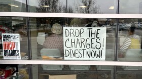 Dozens of people filled the lobby and gallery of Washtenaw 14A-1 District Court to support seven people charged with felons in relation to a police dispersal of an encampment on the University of Michigan's Diag in May.