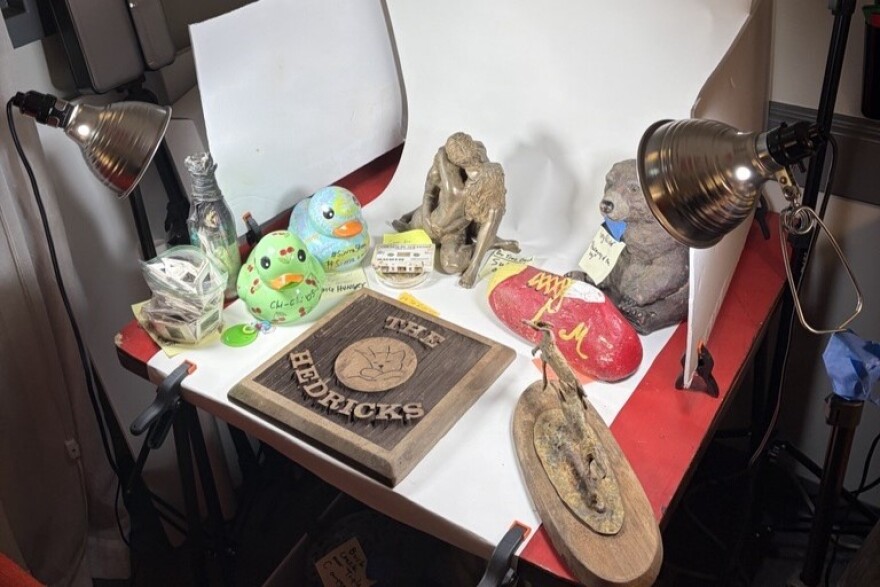 In Wallace’s office, there’s a small photo booth area, archaeological tools and found objects spread across nearly every surface. Wallace catalogues each item, including the latitude and longitude of where it was recovered.