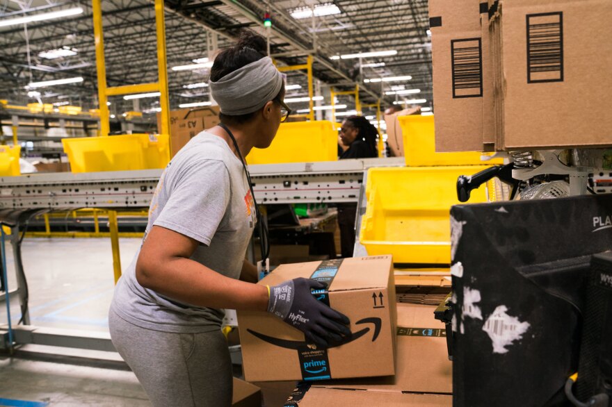 An employee works on an order in Amazon's fulfillment center in Baltimore. Amazon's forecasting team works on anticipating demand for everything sold by the company worldwide.