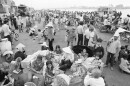Nowhere to go and nothing to do, South Vietnamese refugees from Hue and the northern provinces pause on the dock waiting for the government to relocate them to the central coastal area at Da Nang in Vietnam, March 28, 1975. (AP Photo/Dang Van Phuoc)