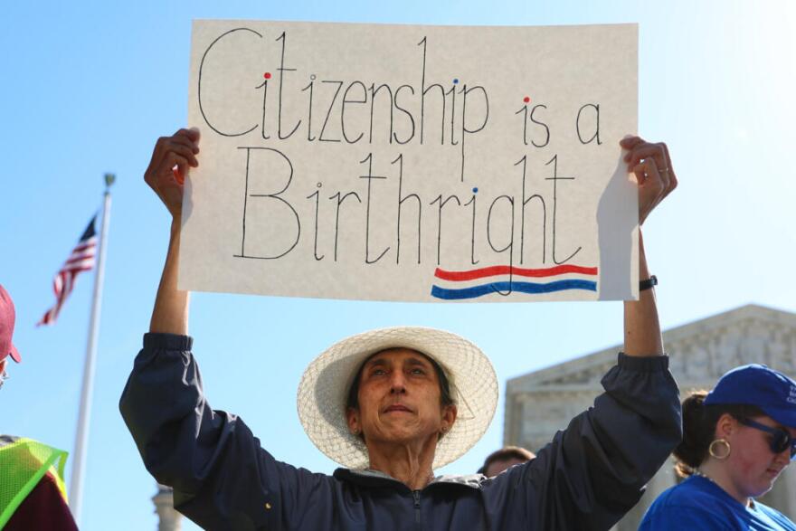 Demonstrators rally outside the U.S. Supreme Court as justices hear oral arguments on whether President Donald Trump can deny citizenship to children born to parents who are in the United States illegally or temporarily, on Capitol Hill in Washington, Wednesday, April 1, 2026. (Tom Brenner/AP)