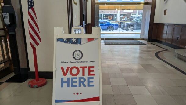 A "Vote Here" sign at an early voting location