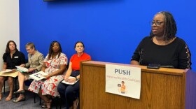 Nichole Wardlaw, a midwife with the American College of Nurse-Midwives, speaks at a press event at the capital.