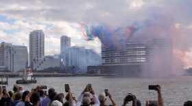 People watch pyrotechnics just before the controlled implosion of the former Mandarin Oriental Hotel on Brickell Key, Sunday, April 12, 2026, in Miami.