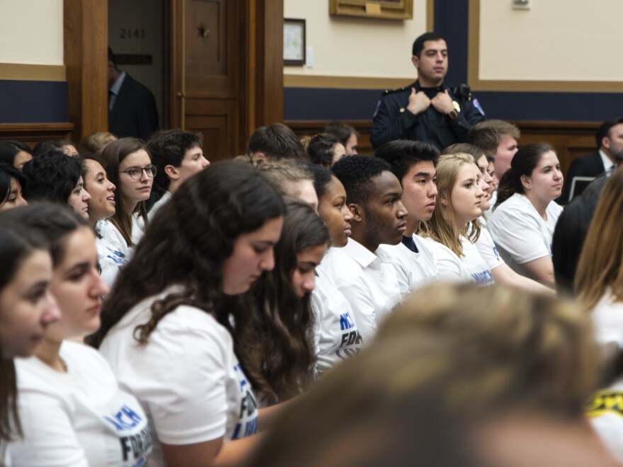 Students and "March for Our Lives" participants listen to the House Judiciary Committee hearing on gun violence at Capitol Hill.