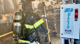 Evansville firefighters inside the former Aramark building on Florence St., where a fire in a dryer spread to the roof, July 30, 2026