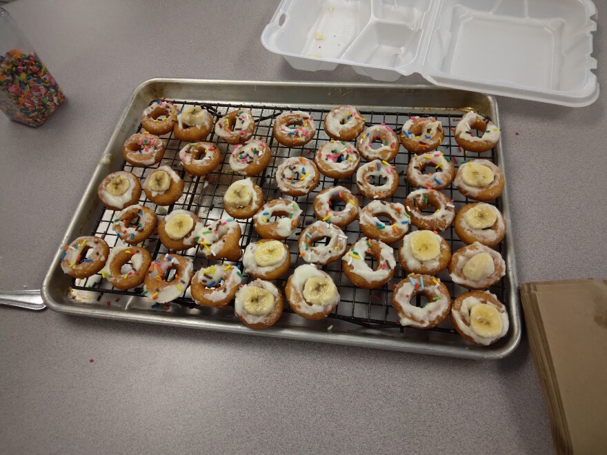 A tray of finished doughnuts awaits to be packaged and delivered to students and staff at the YES House. What started as an in-house endeavor has since expanded to outside locations, such as the local senior center.