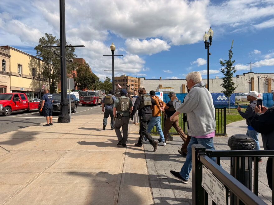 Members of an activist rapid response team film ICE agents outside a courthouse in Meriden on Wednesday, Sept. 23, 2026.