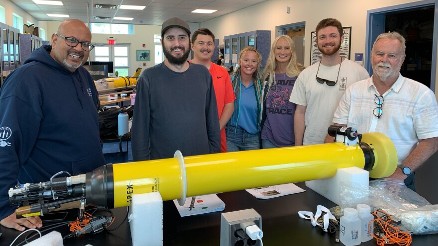 Pictured: Members of UVI’s Ocean Glider Lab, CMES and NOAA prepare a BGC-Argo float for deployment in USVI waters.