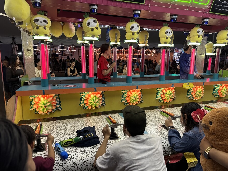 In addition to rides and food, attendees also enjoyed a tent of classic fair games and prizes.