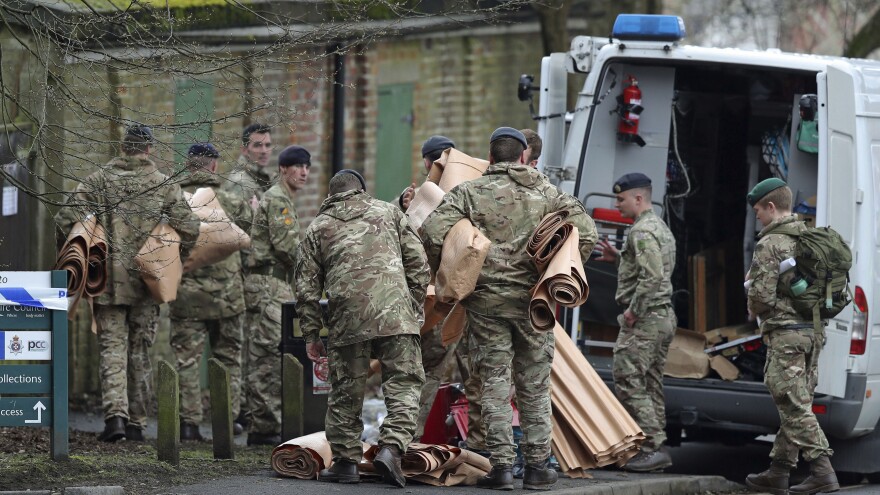 Military personnel outside Bourne Hill police station in Salisbury, England, Sunday, as police and members of the armed forces probe last week's suspected nerve agent attack on Russian double agent spy Sergei Skripal.