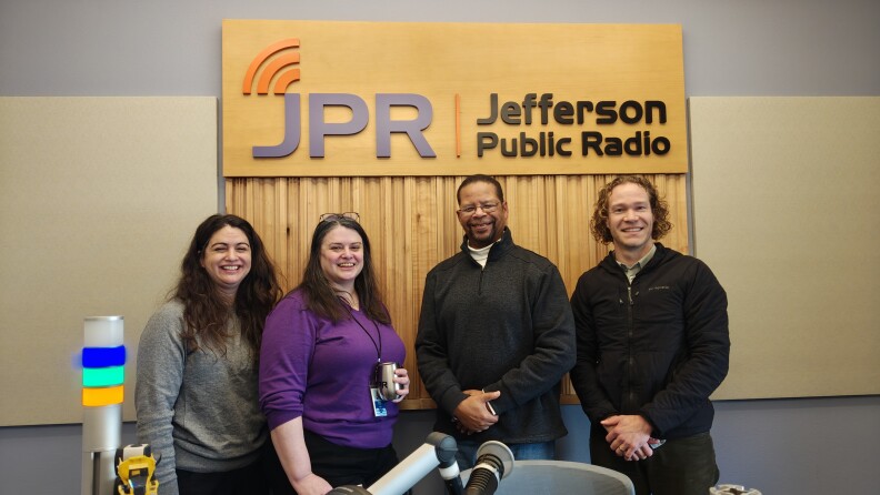 Jackson County Library Services Selections Librarians Felishia Jenkins (left) and April Bozada-Armstrong visit the JPR studio with Josh Letsinger, JCLS Community Engagement Manager (right) on Dec. 9, 2025. Mike Green hosts JX Reads on the Jefferson Exchange as a new monthly series.
