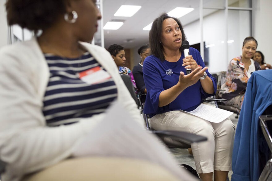 Vickie Miller asks Anita Earls, a candidate for the North Carolina Supreme Court, a question during a Sister to Sister salon conversation at the Chesterfield in Durham on Friday, October 26, 2018.