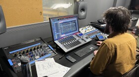 A UW student works at the recording console in Control Room B.