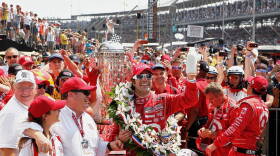 Dario Franchitti hoists the milk in Victory Lane in 2012, which has been offered to every Indy 500 winner since 1956.