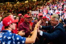 Sen. Roger Marshall, R-Kan., right, greets supporters before hearing President Donald Trump speak during a campaign rally at Heartland Credit Union Arena, Monday, Oct. 19, 2026, in Park City, Kan. (AP Photo/Julia Demaree Nikhinson)
