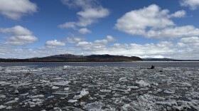 The Kuskokwim River breaks up in front of Aniak amid high water and an active flood warning for the community on May 8, 2026.
