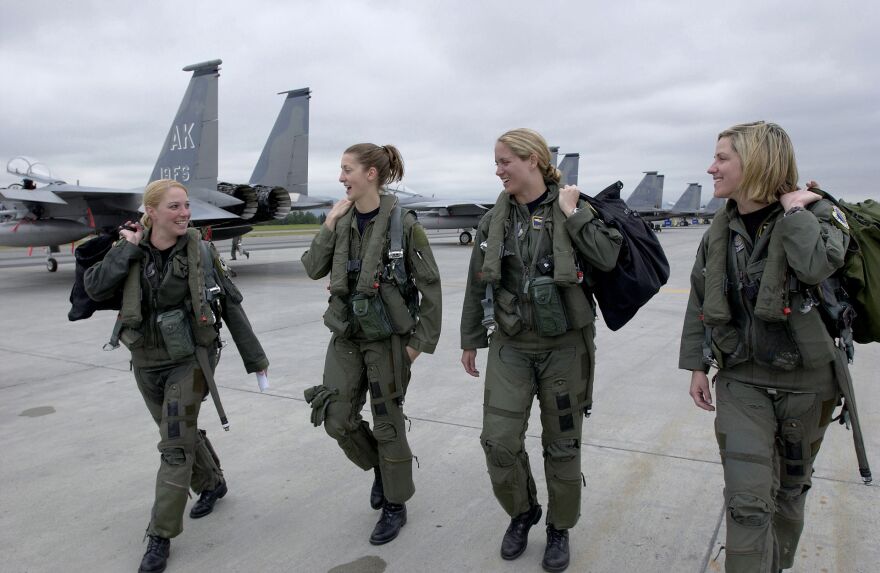 Four F-15 Eagle pilots from the 3rd Wing walk to their respective jets at Elmendorf Air Force Base, Alaska