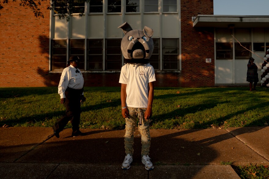 Sumner High School junior Mkyh Stroub waits outside Stevens Middle School during the first day of classes on Monday, Aug. 18, 2025, in Vandeventer neighborhood. Stroub and his classmates were moved to the middle school after a deadly EF3 tornado ripped through St. Louis last May, severely damaging the historic Sumner building, which taught the likes of world-renound musicians Tina Turner and Chuck Berry. Six months later, the damage to St. Louis’ historically Black neighborhoods can be seen — and felt — as residents attempt to tapple with the federal government’s wish to dismantle the Federal Emergency Management Agency. (Brian Munoz / St. Louis Public Radio)