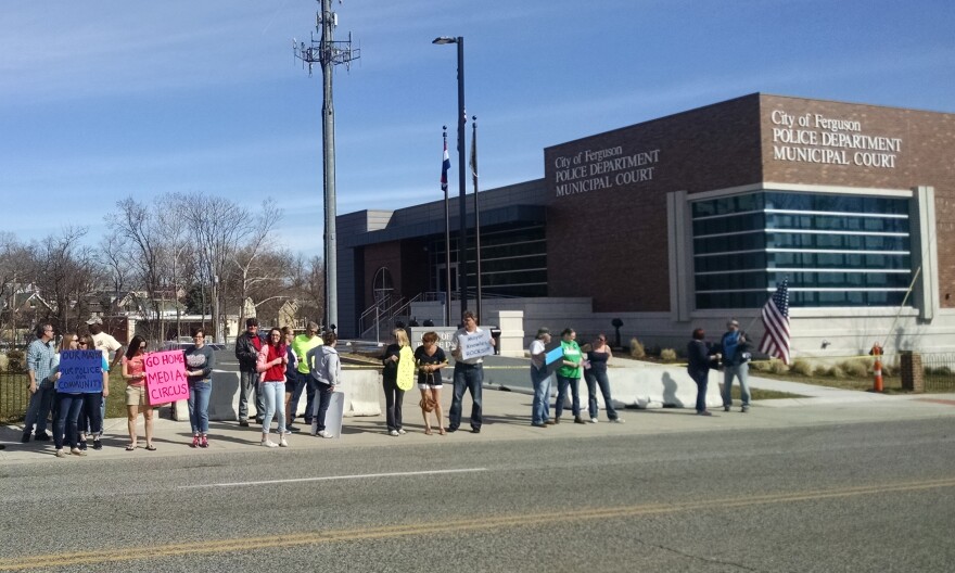 A line of police supporters rally outside the Ferguson Police Department in March 2015.